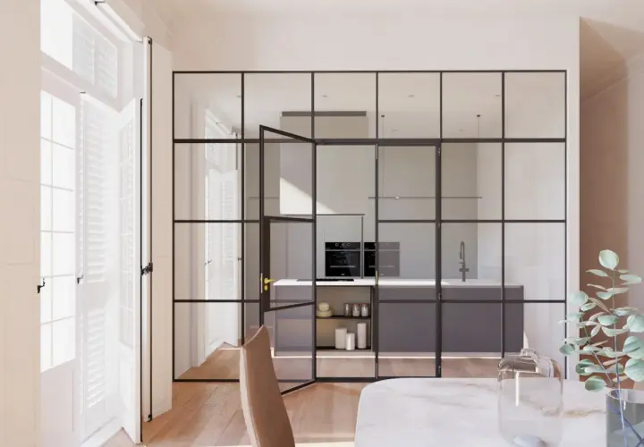 Elegantes tipos de cerramientos interiores de cristal y metal separan la cocina moderna del comedor.