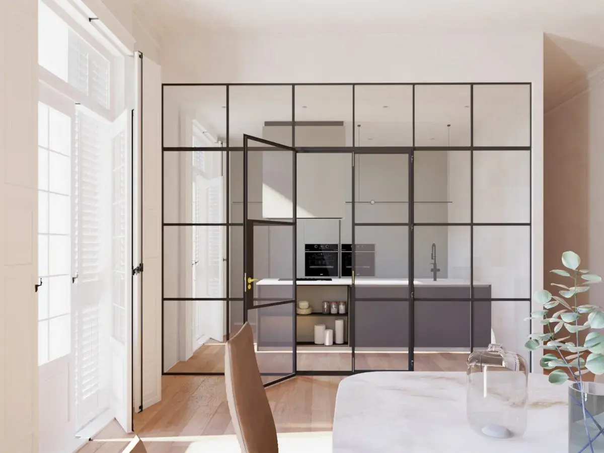 Elegantes tipos de cerramientos interiores de cristal y metal separan la cocina moderna del comedor.