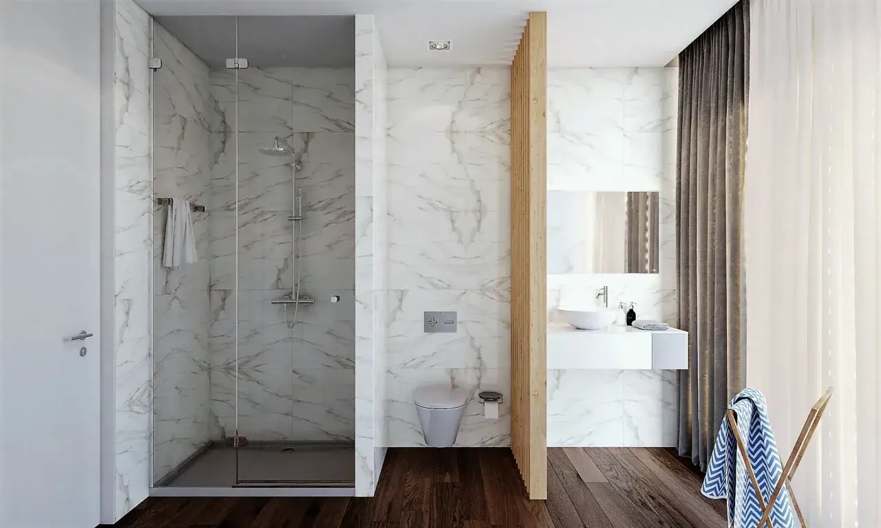 Modern bathroom with marble tiles, a walk-in shower with a low-profile base, and a floating vanity. Ideal for a seamless transition, like a cambiar plato de ducha por otro a ras de suelo.